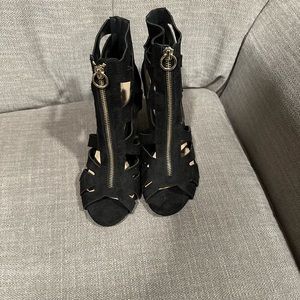Black heals with gold zipper